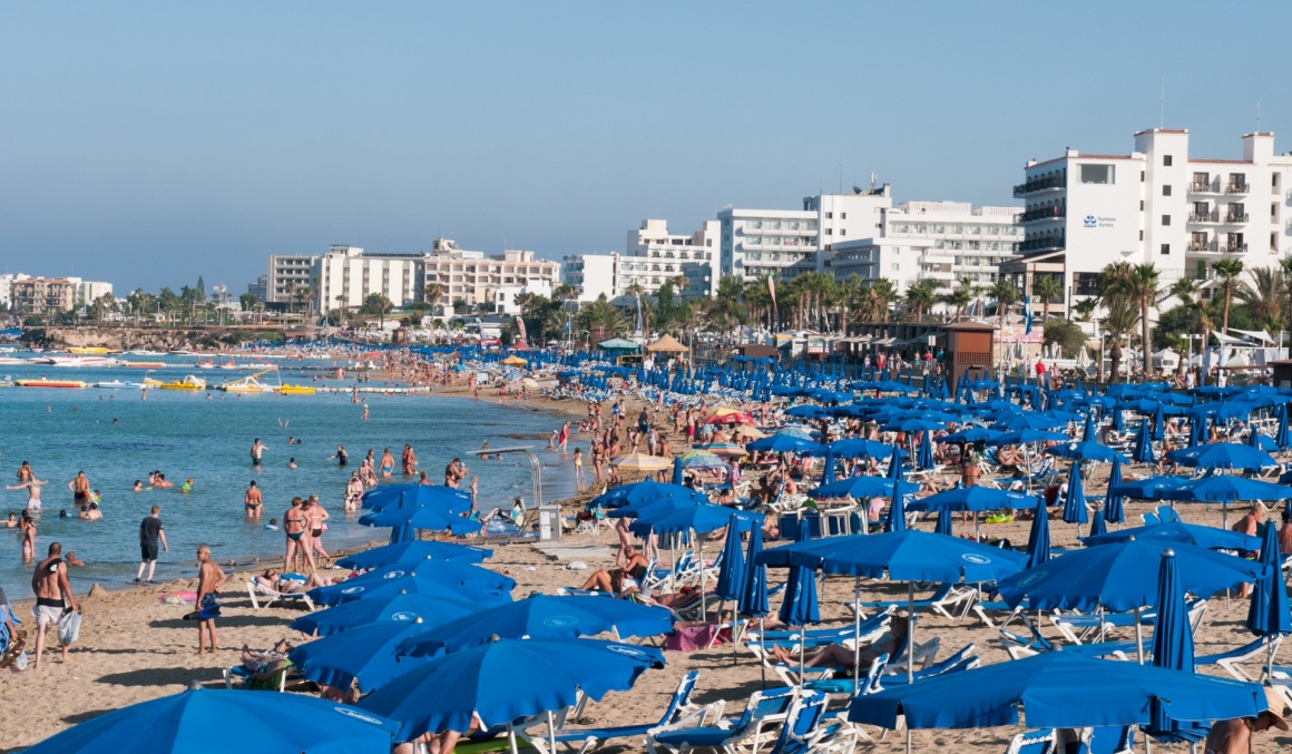 'PROTARAS,  CYPRUS -  July 8 2013: Tourists at Protaras bay beach relaxing and  enjoying their summer holidays on July 8 2013 at Protaras area in  Cyprus' - Cyprus